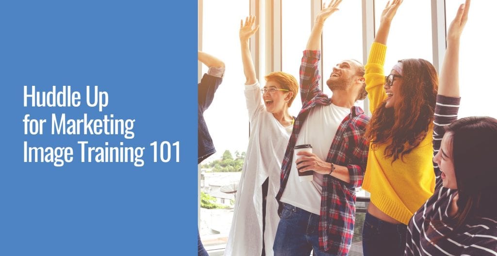 A group of people happily raising their hands together