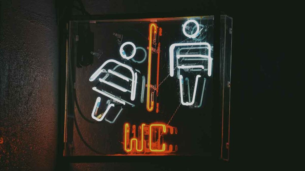 Marketing clichés can provide clarity, unlike this neon restroom sign, which features symbols for male and female which are difficult to understand.